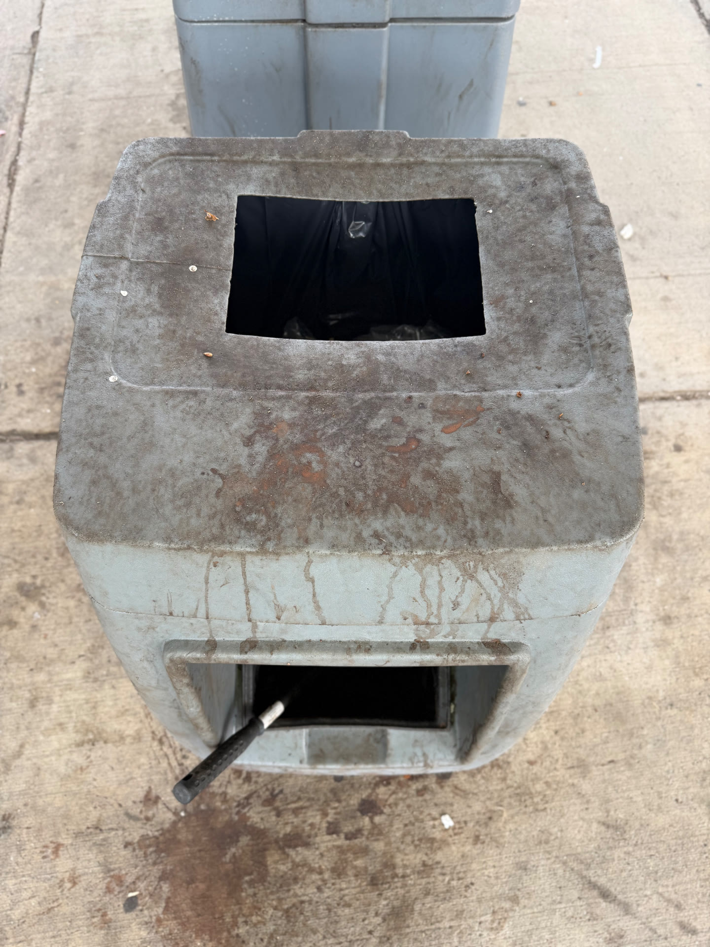 Forecourt trash receptacle — before FuelMark cleaning